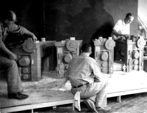 Workmen prepare Steel Mill diorama in Medallion City