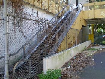 Fenced off escalator