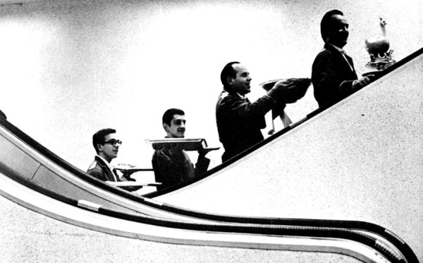 Waiters on Escalator